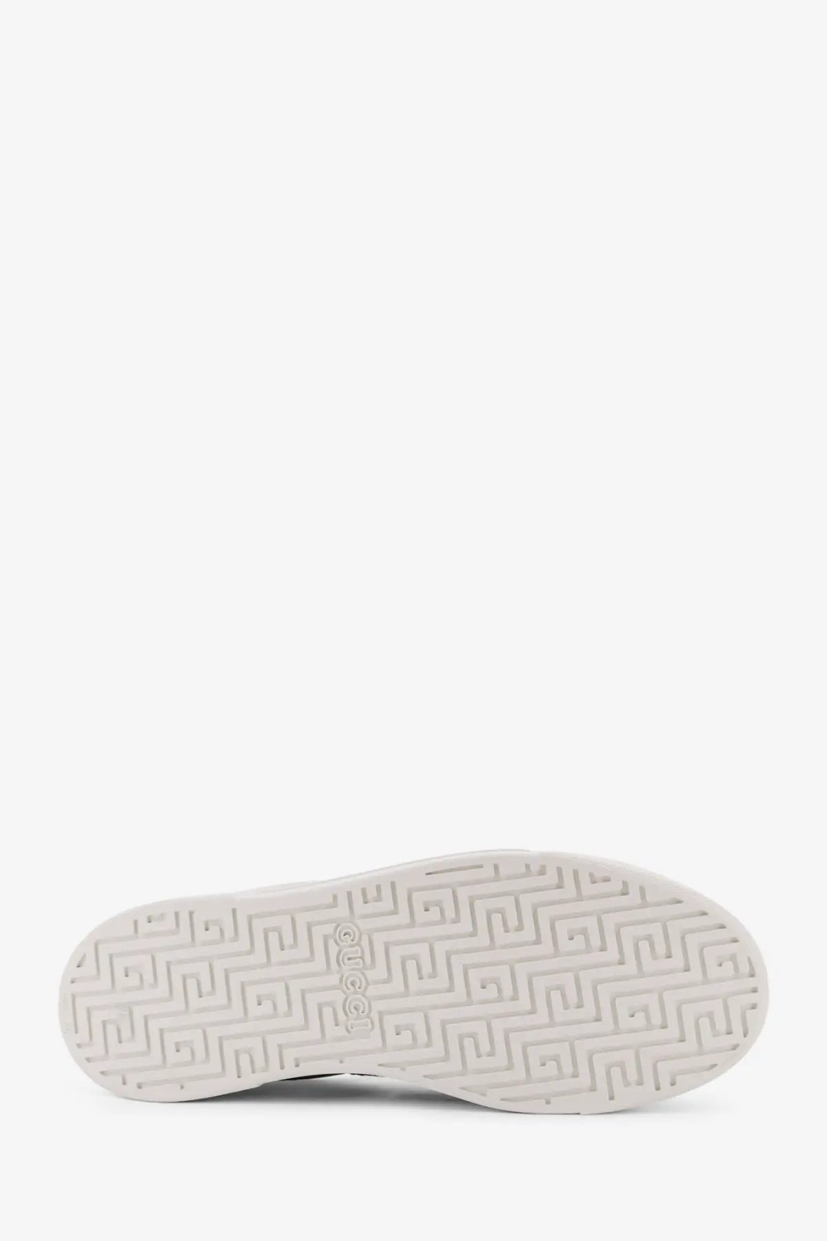 White rubber sole with geometric pattern and icon logo on gucci men’s ace low top green leather sneakers