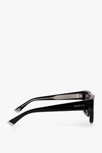 Black Gucci men’s acetate sunglasses with glossy finish and silver metal accents on the temples