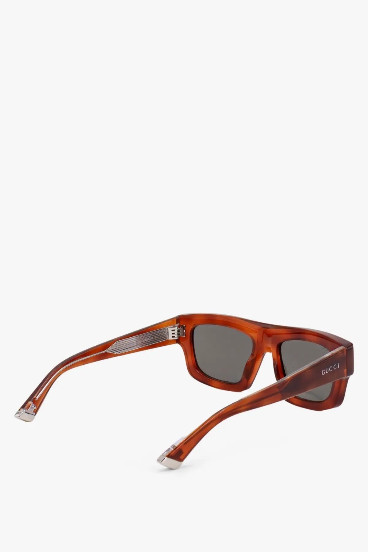 Gucci men’s acetate sunglasses in tortoiseshell with dark gray lenses and silver toned metal accents