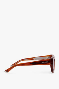 Gucci men’s acetate sunglasses with tortoiseshell rectangular frames and silver-toned metal accents