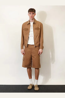 Gucci men’s beige canvas utility jacket with textured patch pockets paired with matching brown cargo shorts