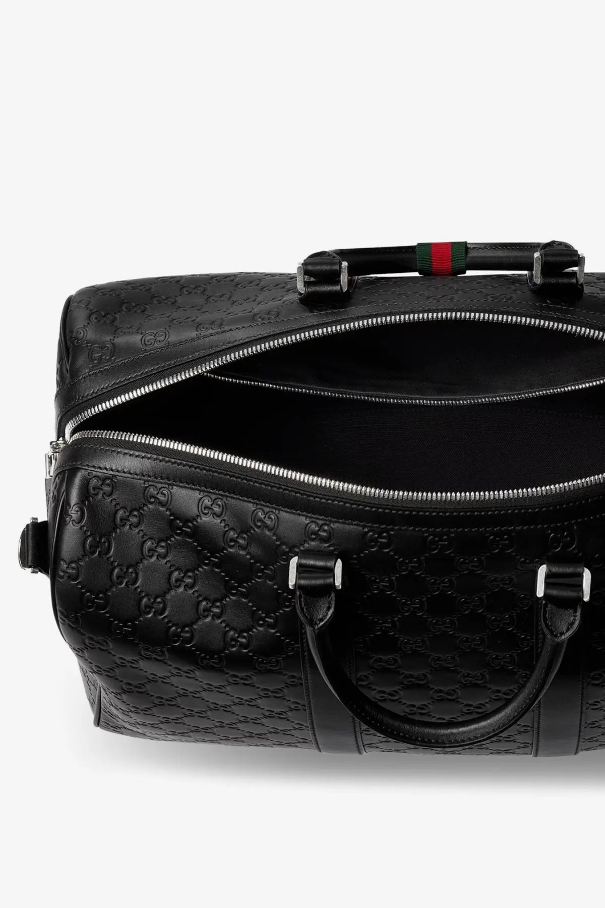 Black Gucci men’s coated canvas GG emblem travel duffel bag with leather, signature interlocking g pattern, and red-green webbing handle