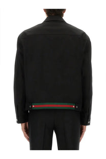 Black gucci men’s cotton twill jacket featuring a distinctive red and green striped band at the hem