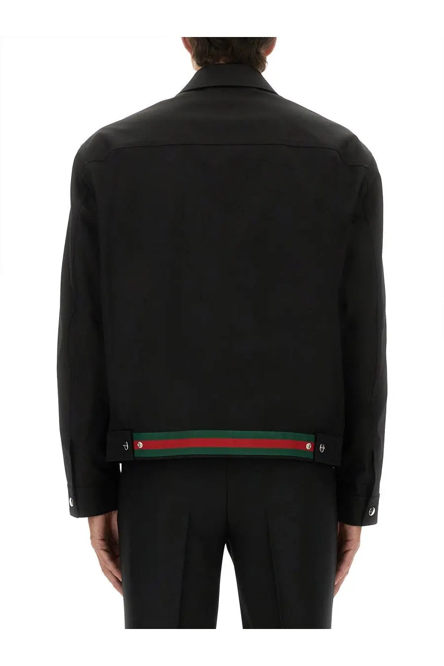 Gucci men’s black cotton twill jacket with distinctive red and green striped band at the hem back view