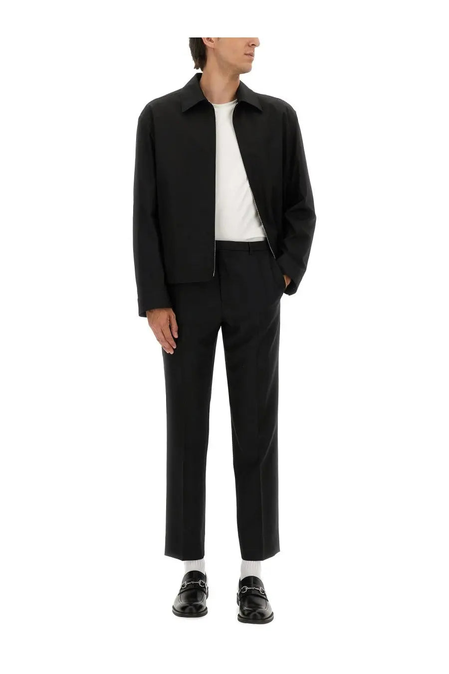 Gucci men’s black cotton twill tailored jacket with classic collar and front zipper worn over white tee