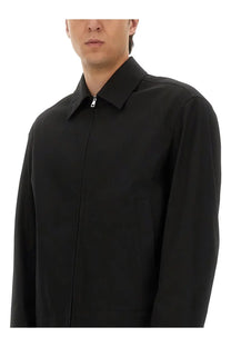 Gucci men’s black cotton twill jacket with zip front, structured collar, and subtle stitching details