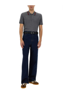 Navy blue Gucci men’s denim pants with straight-leg cut and belt loops made from durable denim fabric