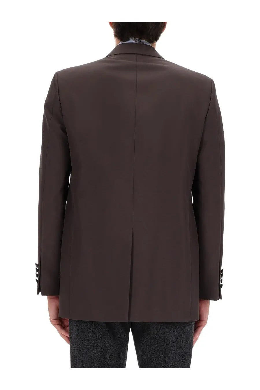 A tailored dark brown wool double breasted Gucci men’s jacket with notched lapels and buttoned cuffs