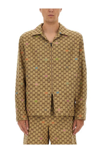 Tan Gucci men’s fabric jacket beige featuring a repeating brown gg logo pattern with colorful accents