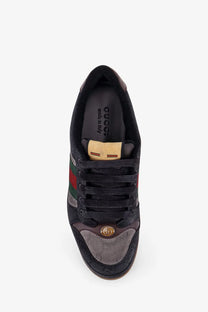 Gucci men’s gg bicolor fabric sneaker in black with red green stripes gold-tone logo and textured fabric panels