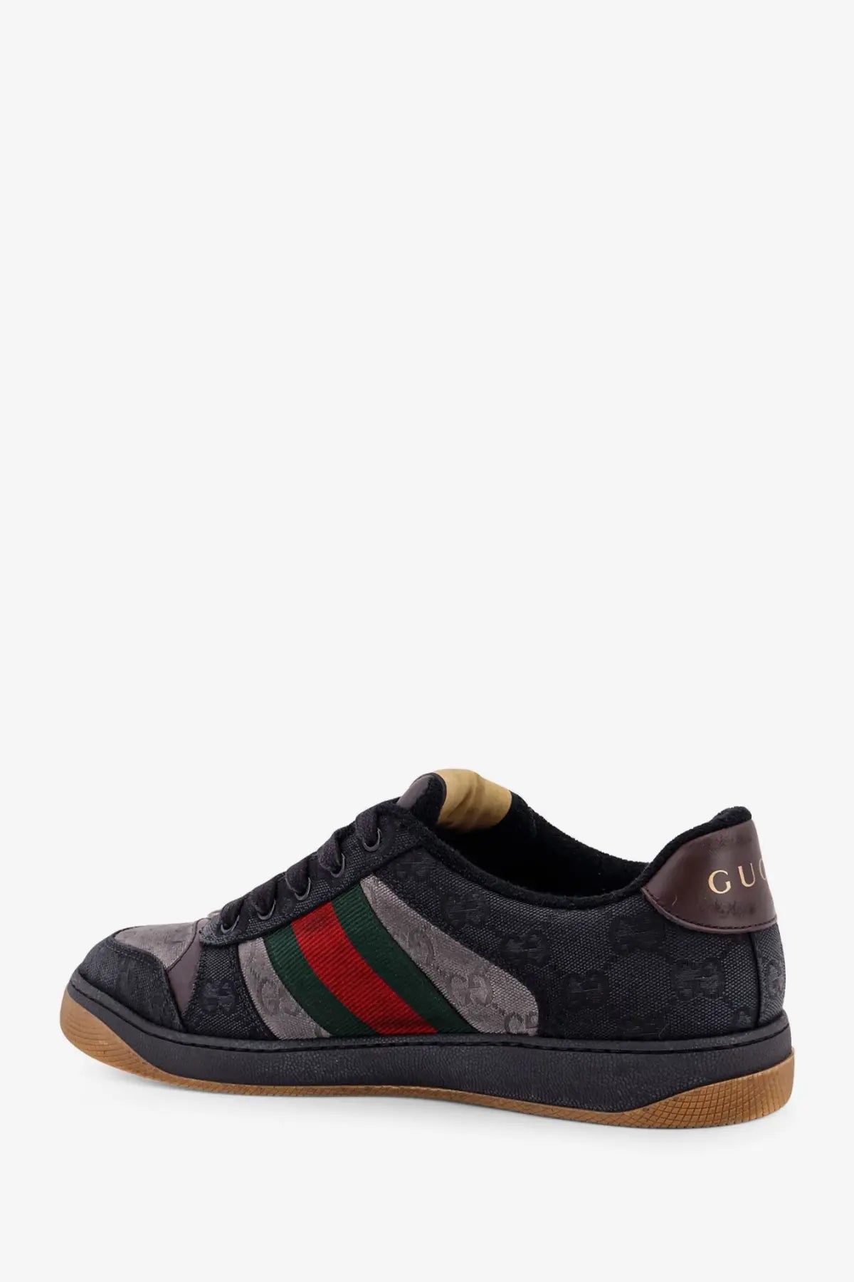 Gucci men’s GG bicolor fabric sneaker in black with red and green striped band, textured upper and brown rubber sole