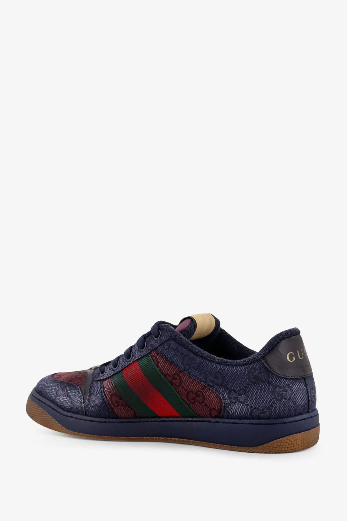 Navy blue Gucci men’s GG bicolor fabric sneaker with red and green striped accents and GG monogram upper