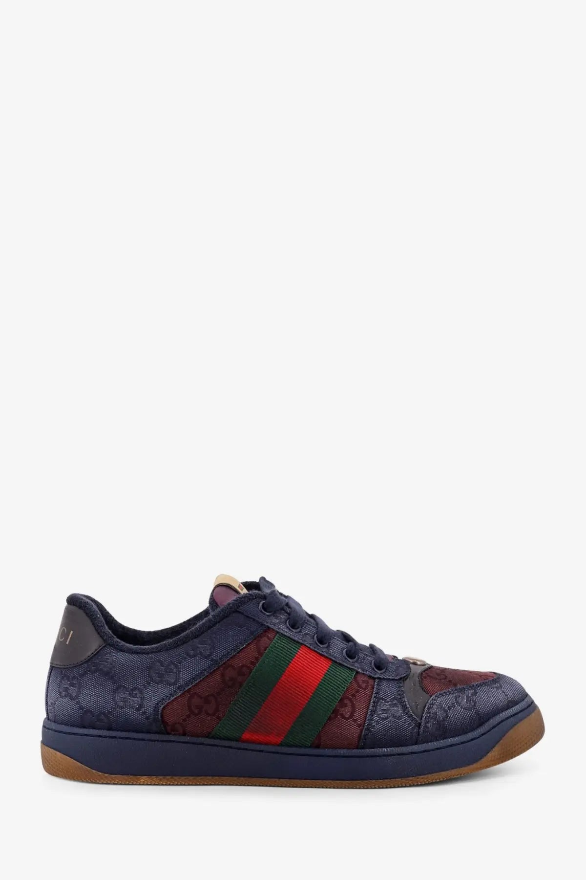Gucci men’s navy blue sneaker with gg supreme canvas upper and red green striped webbing on the side