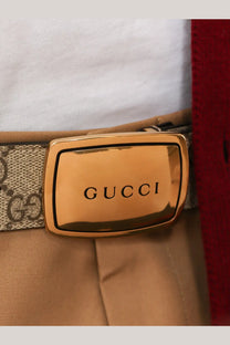 Gucci men’s brown gg coated canvas belt with gold-tone rectangular buckle engraved with Gucci in black