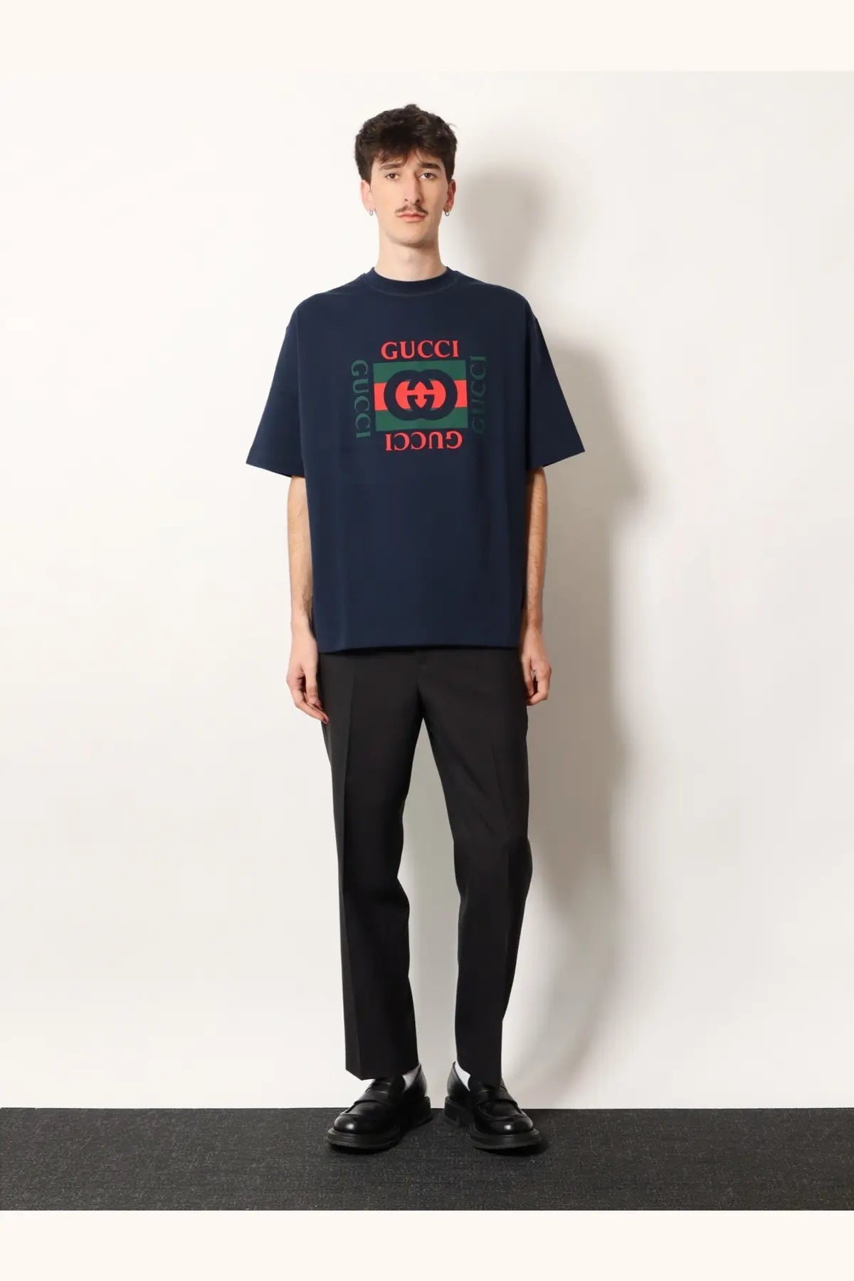Navy blue Gucci men’s cotton t-shirt with bold red and green GG logo print perfect for casual wear