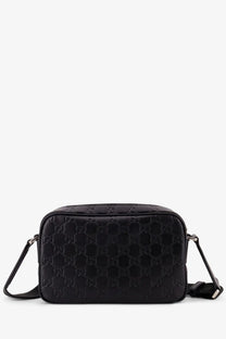 Black gucci men’s leather crossbody camera bag with embossed gg monogram pattern for everyday use