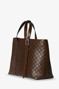 Gucci men’s black leather shopping bag with embossed gg emblem and brown leather tote handles with green and red webbing