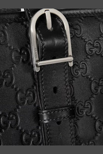 Gucci men’s black leather shopping bag with embossed gg logo pattern and silver-toned metal buckle