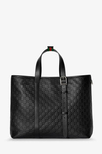 Black gucci men’s gg emblem leather tote bag with signature interlocking g monogram and red-green striped tab