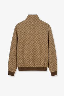Gucci men’s tan fabric jacket with repeating brown interlocking gg logo pattern in beige tone