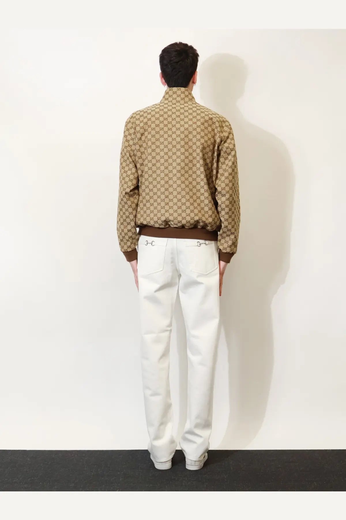 Gucci men’s beige gg fabric bomber jacket with tan and brown supreme material and horsebit waistband detailing