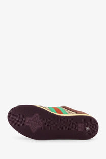 Brown gucci men’s gg fabric leather sneaker with beige green striped upper textured rubber sole and bee logo on heel back view