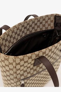 Beige and brown gucci men’s gg fabric shopping bag made of gg supreme canvas with leather handles