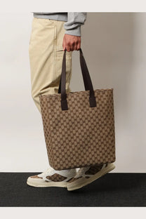 Brown and beige gucci gg supreme canvas tote bag with dark brown leather handles for men shopping use