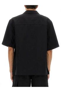 Gucci men’s black GG jacquard short-sleeved button-up shirt with structured collar and minimalist design