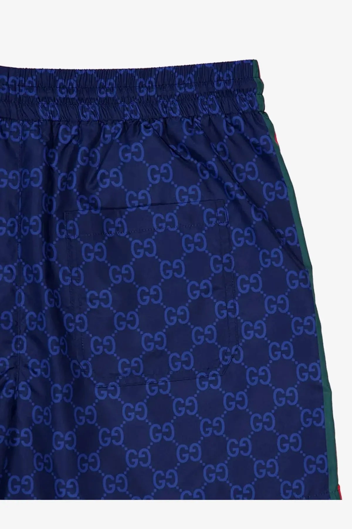 Navy blue Gucci men’s nylon swim trunks with lighter blue repeating interlocking GG monogram pattern