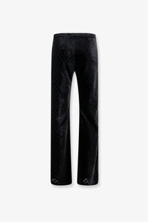 Gucci men’s black stretch devoré velvet trousers with subtle textured pattern and delicate cuff embellishments