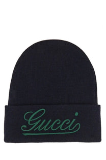Black gucci men’s beanie with teal embroidered logo on folded brim in soft knit fabric