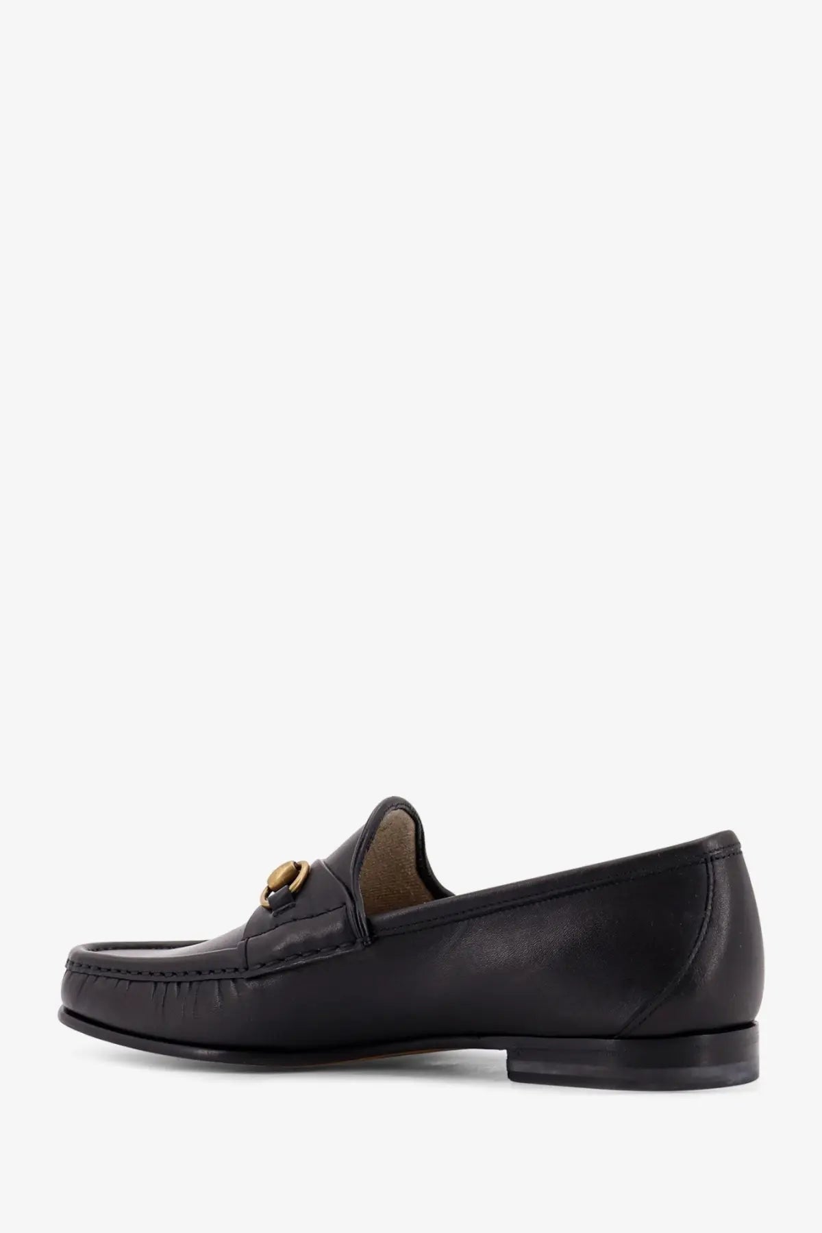 Gucci men’s horsebit leather loafer in black featuring a gold-tone horsebit buckle and smooth leather finish
