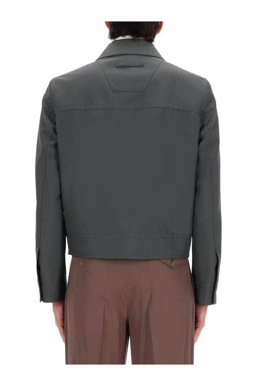 Gucci men’s dark gray structured jacket with clean lines and subtle stitching details