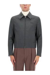 Dark gray Gucci men’s jacket with subtle embroidered logo on left chest ideal for stylish casual wear