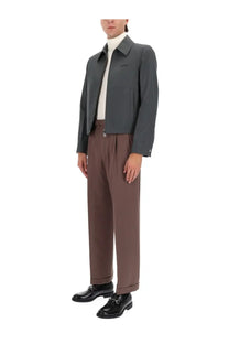 Dark gray tailored gucci men’s jacket with subtle logo on the left chest ideal for formal wear