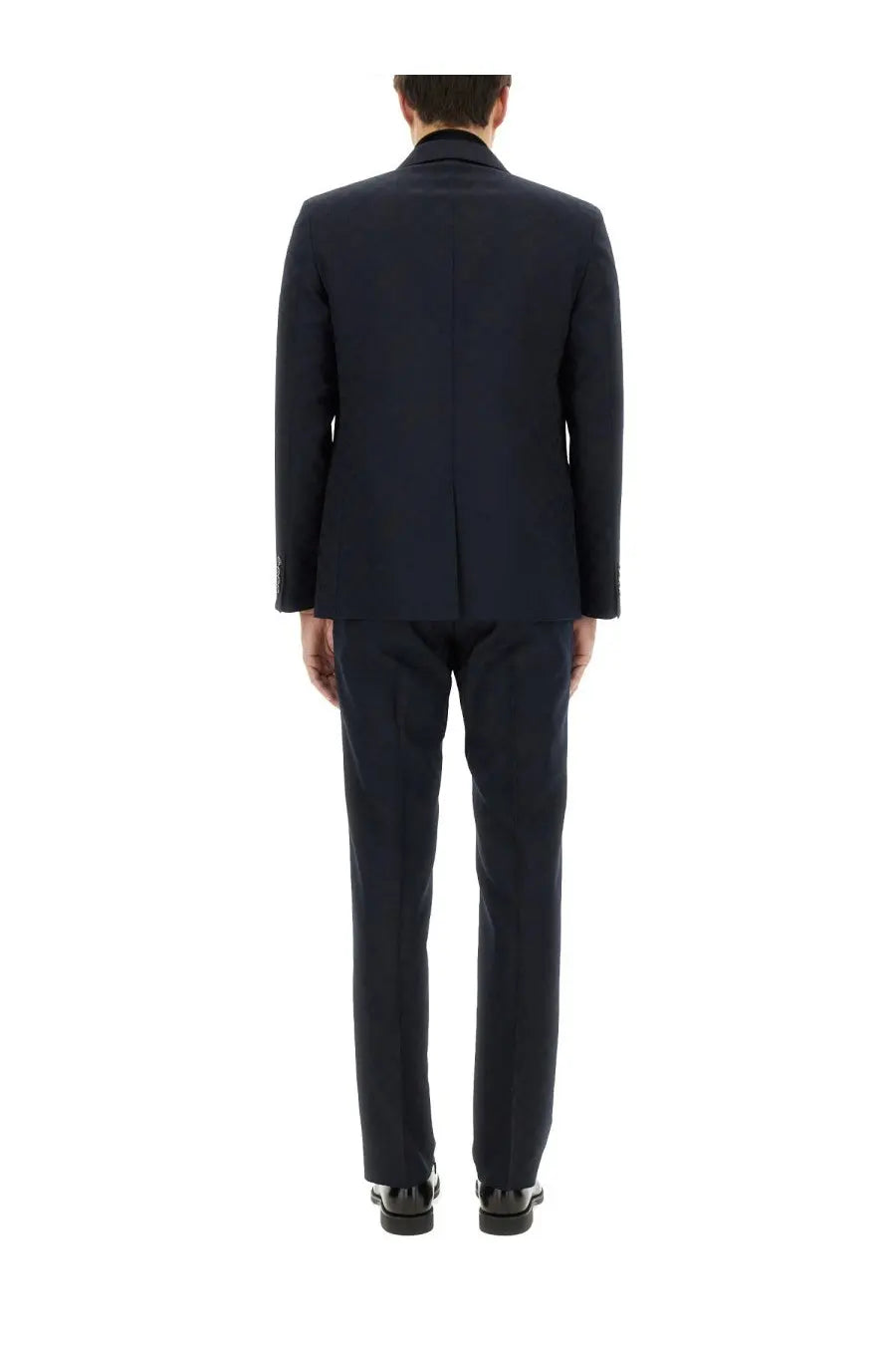 A sleek navy blue wool Gucci men’s jacquard dress suit with classic tailored fit and subtle texture