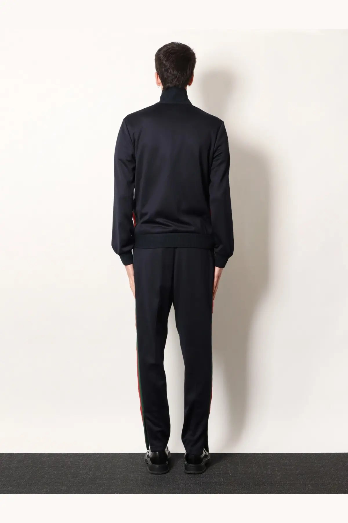Black turtleneck track suit with subtle red side stripes in jersey material for casual wear