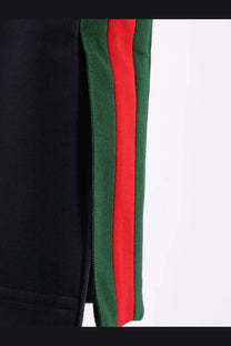 Black Gucci men’s jersey track pants with bold red and green striped side panels in a sporty design