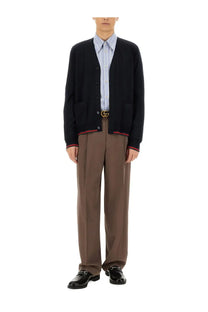 Gucci men’s knitted wool cardigan in black with red and white striped trim on sleeves and collar