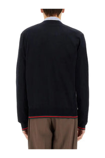 Gucci men’s knitted wool cardigan black with red and green striped trim at hem and cuffs front view