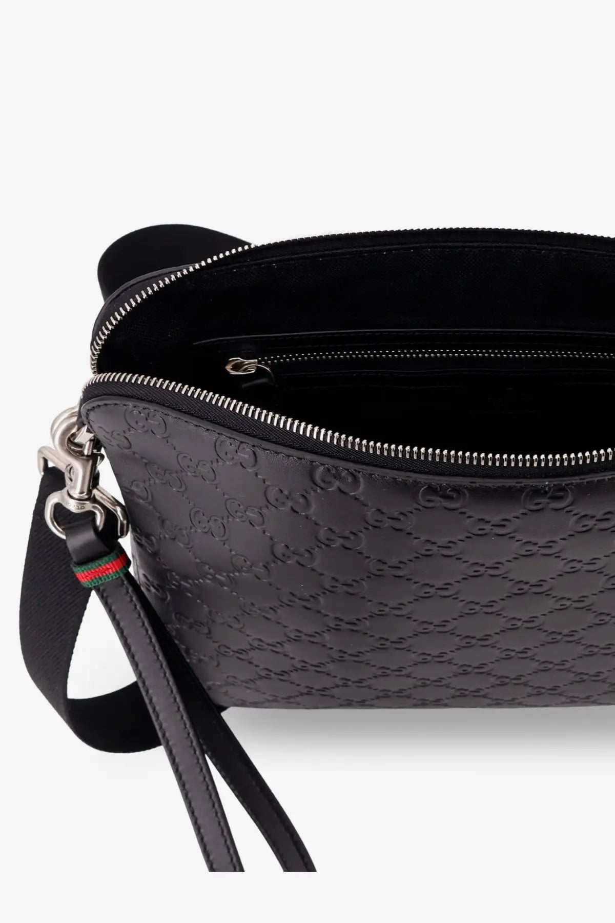 Black gucci men’s leather crossbody belt bag with embossed gg monogram pattern and silver-toned hardware