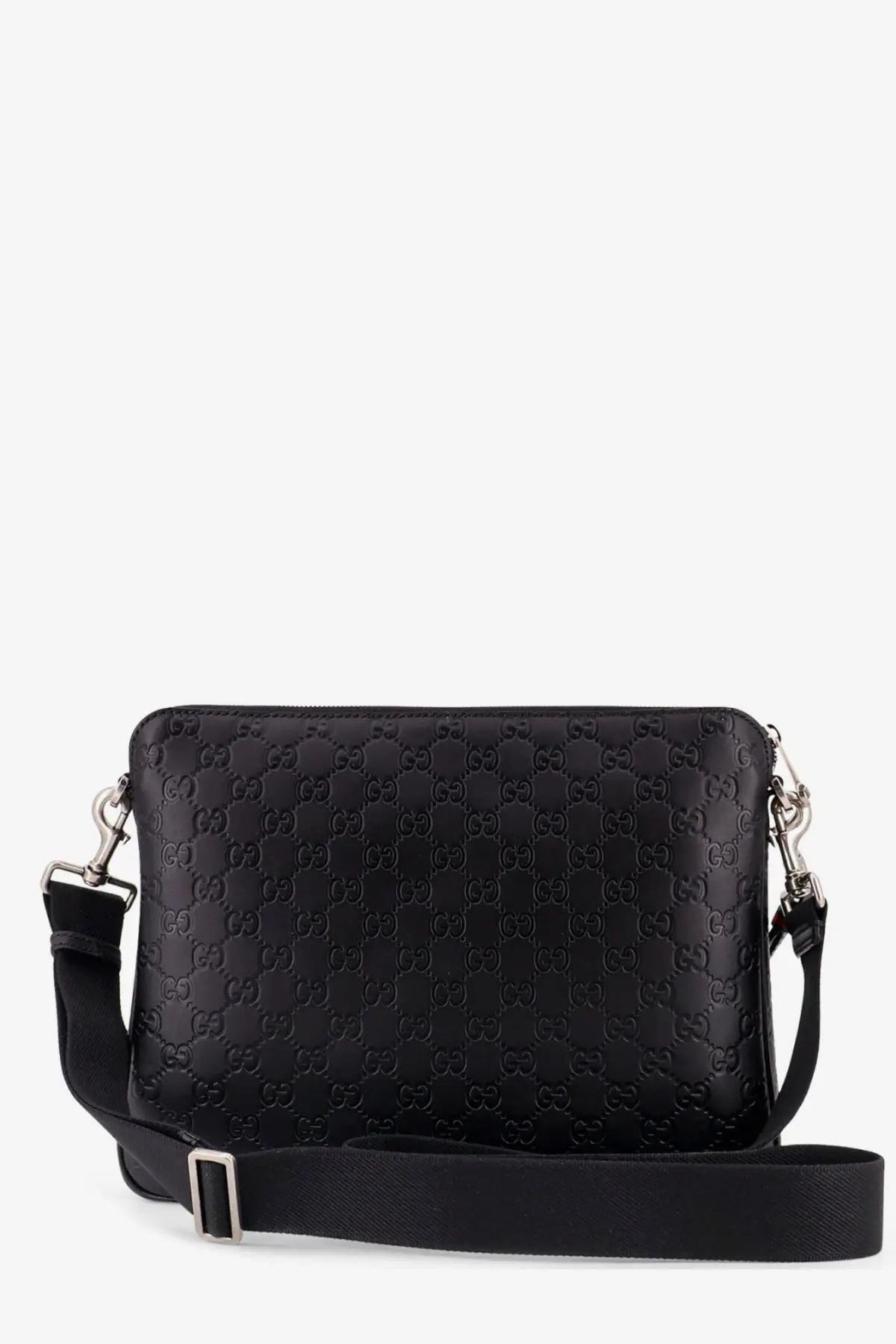 Black Gucci men’s leather GG emblem crossbody bag with embossed monogram pattern and adjustable strap