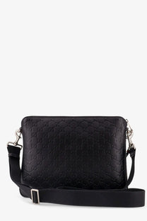 Black Gucci men’s leather GG emblem crossbody bag with embossed monogram pattern and adjustable strap