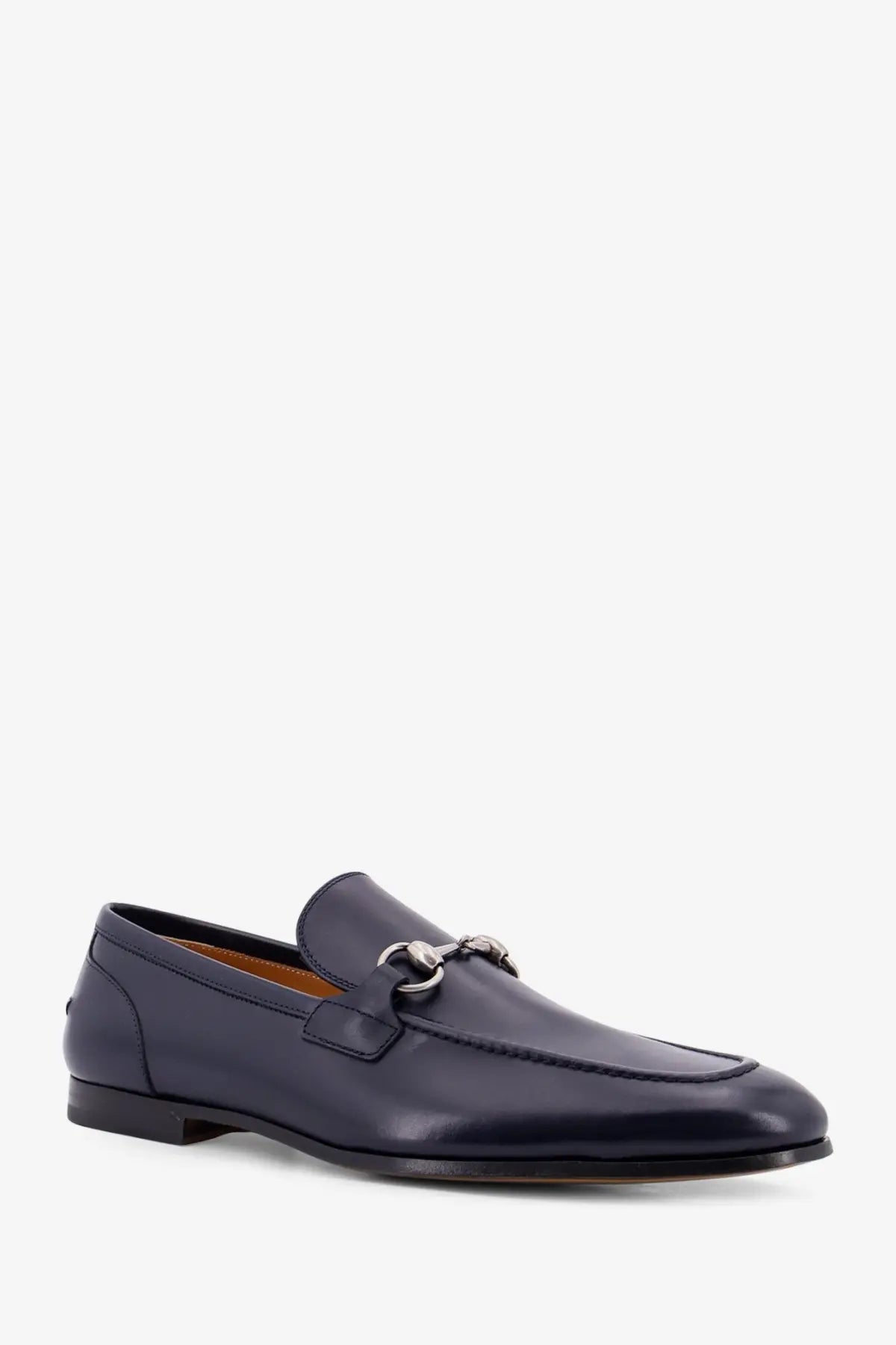 Gucci men’s navy blue leather loafer with silver horsebit buckle showcasing luxurious design and craftsmanship