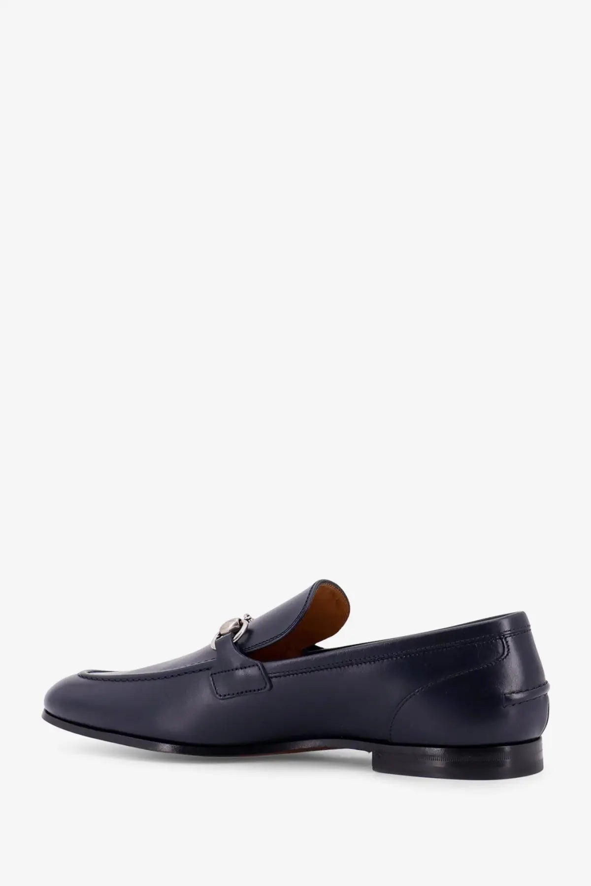 Gucci men’s navy blue leather loafer with silver horsebit buckle and tan interior lining for stylish wear