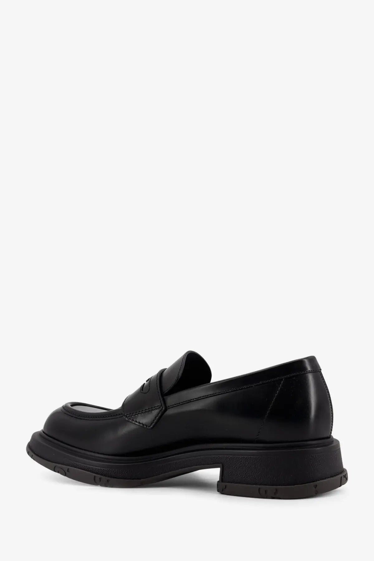Gucci men’s black leather loafers with chunky sole and glossy finish for stylish casual wear