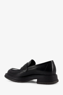 Gucci men’s black leather loafers with chunky sole and glossy finish for stylish casual wear