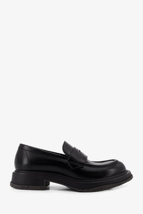 Gucci men’s black leather loafers with chunky sole and classic slip on design for stylish everyday wear