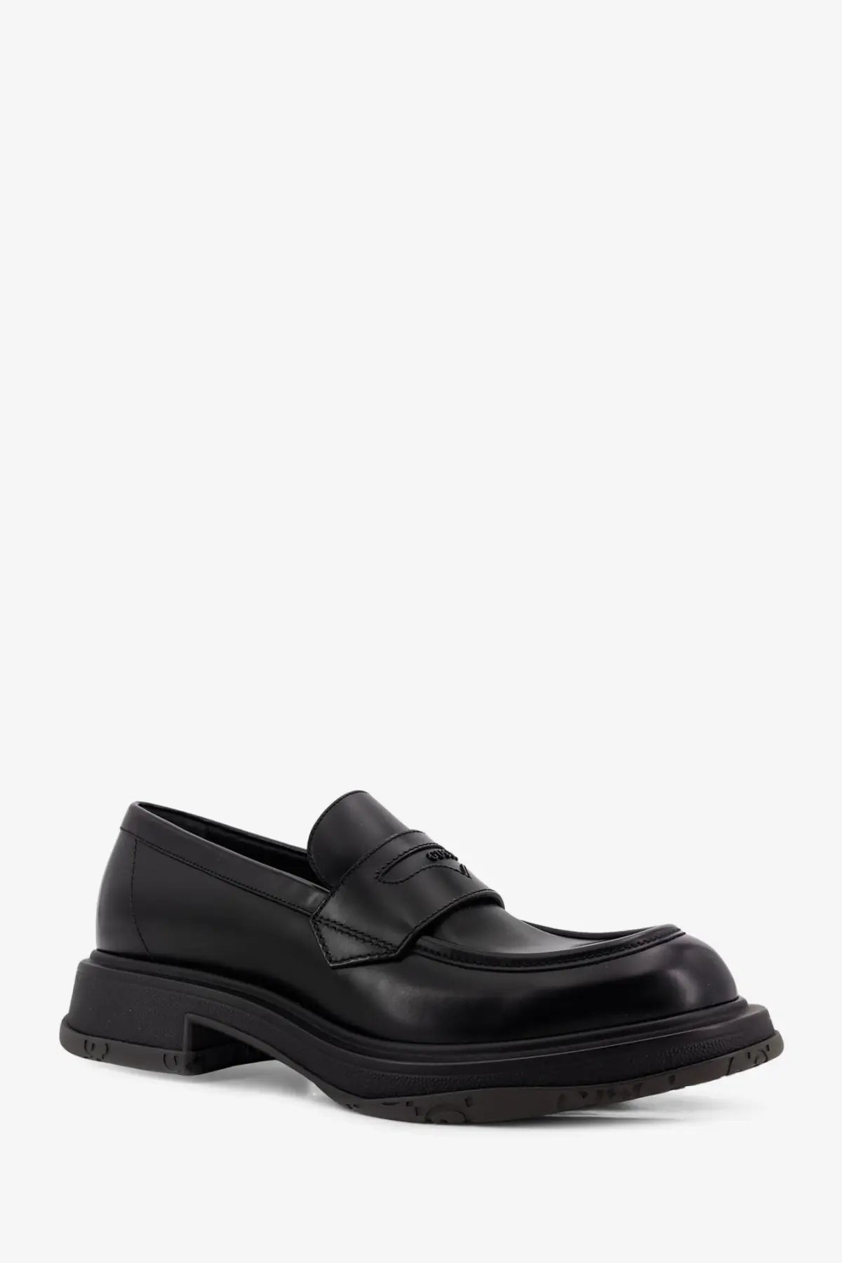 Black leather prada loafers with a glossy finish and chunky sole styled as gucci men’s leather loafers black